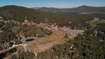 Aerial Shot Panning Across Big Bear with the Lake in the Distance.