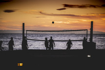 beach volley ball at sunset 
