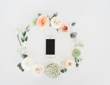 floral wreath around a cellphone 