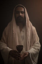 Jesus holding a chalice at the Last Supper 
