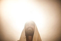 glowing light behind Christ 