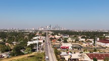 Complete skyline of downtown Houston, Texas far off into the distance on a clear blue sky day.