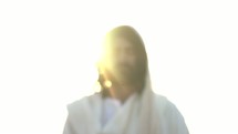 Jesus standing in glowing light
