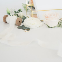 glass box with stationary and roses 
