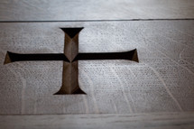 Cross carved in to wood.