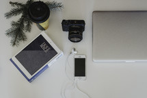 camera, phone, iPhone, cellphone, laptop, desk, pine boughs, camera lens, desk, coffee cup, winter, earbuds, Bible 