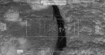 Drone with thermal night vision view of terrorists with camera zooming in
