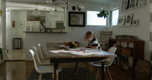 a child coloring at a dining room table 