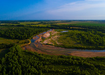 Aerial shot of a winding river on the plains.