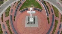 aerial view over memorial with cross