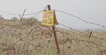 Minefield warning sign in the Golan Heights in the Syria Israel border