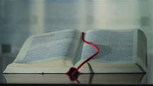Holy Bible with bookmark. Camera rotation.