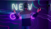 Bearded man moving his arms around while playing a virtual reality game.
