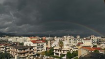Rainbow shining on an urban view 