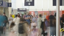 Paris, France - June 25, 2023. Timelapse of Passengers walking inside terminal 2 at Charles de Gaulle airport