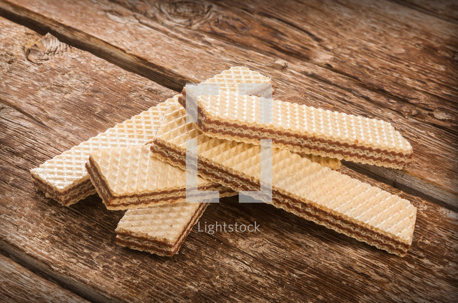 wafers with chocolate on rustic wooden table