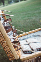a picnic basket in the grass 