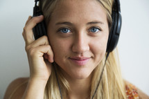 a teen girl listening to headphones 