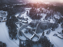 aerial view over a roller coaster in snow 