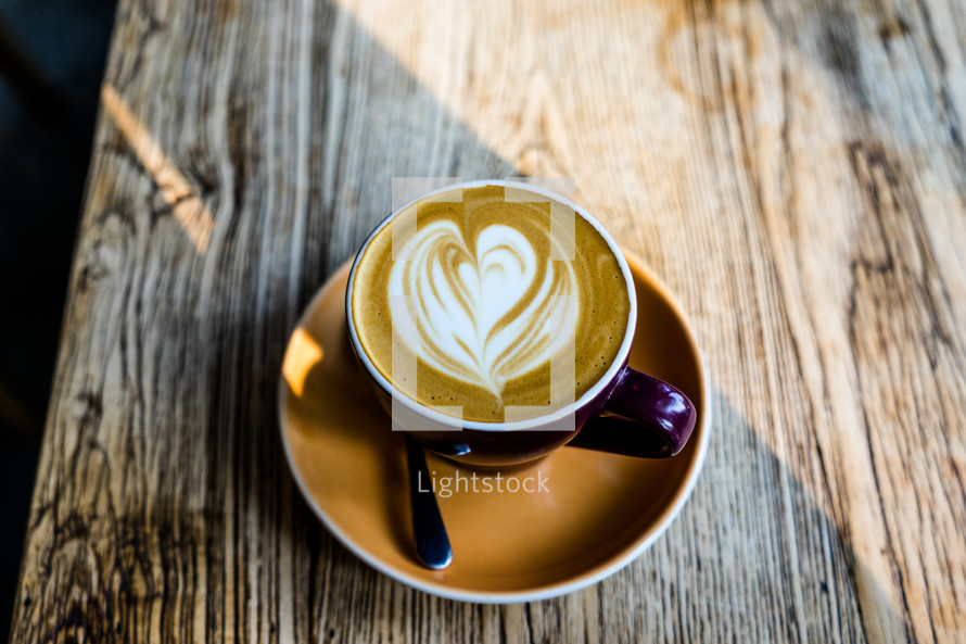 heart shaped creamer in a latte 