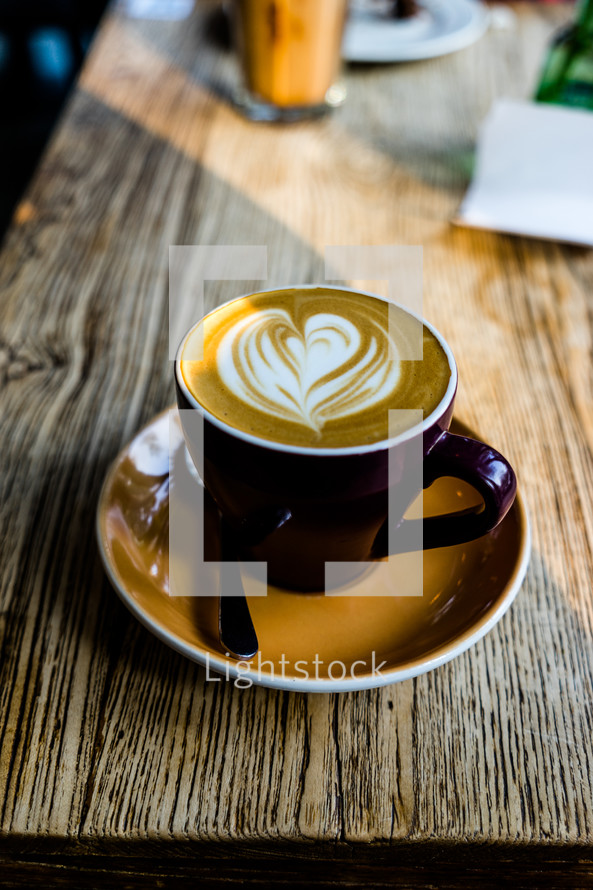 heart shape creamer in a latte 