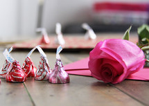 Hersey Kisses, envelope, and pink rose