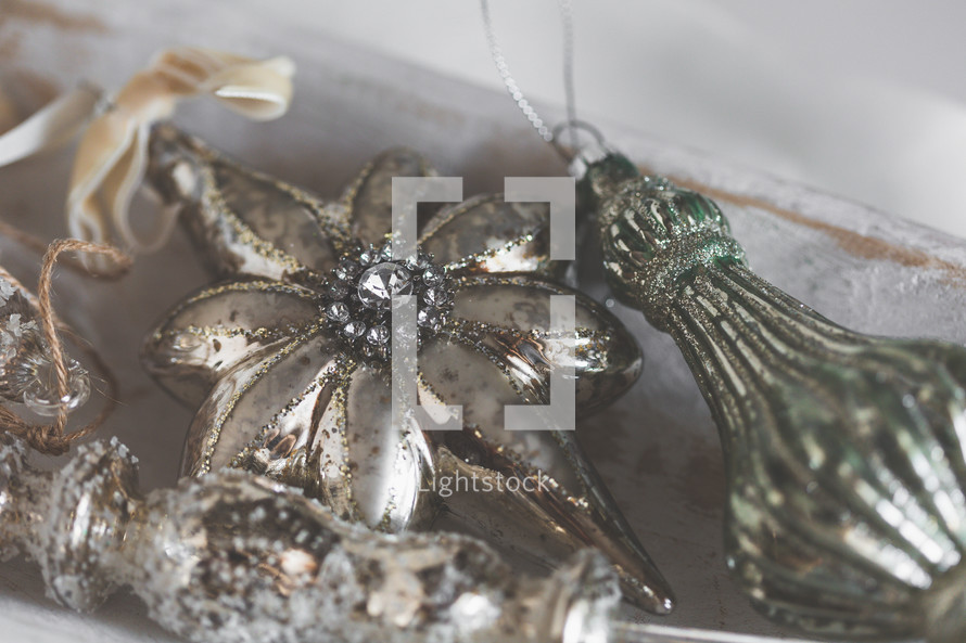 Close Up of Shiny Christmas Ornaments on White Background