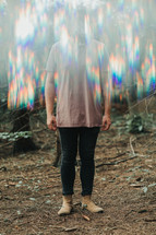a man standing in blurry light 