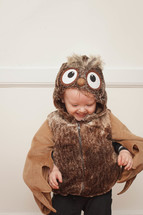 toddler boy in an owl Halloween costume 