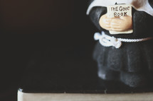 nun, Figurine, holding, BIBle, good book 