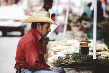 vendor in a cowboy hat 