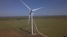Aerial pullback of wind turbines generating electricity