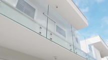 Detail of a glass balcony parapet