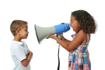 a sister yelling at her brother with a megaphone 