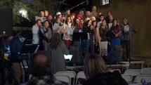 A choir singing carols at Christmas time