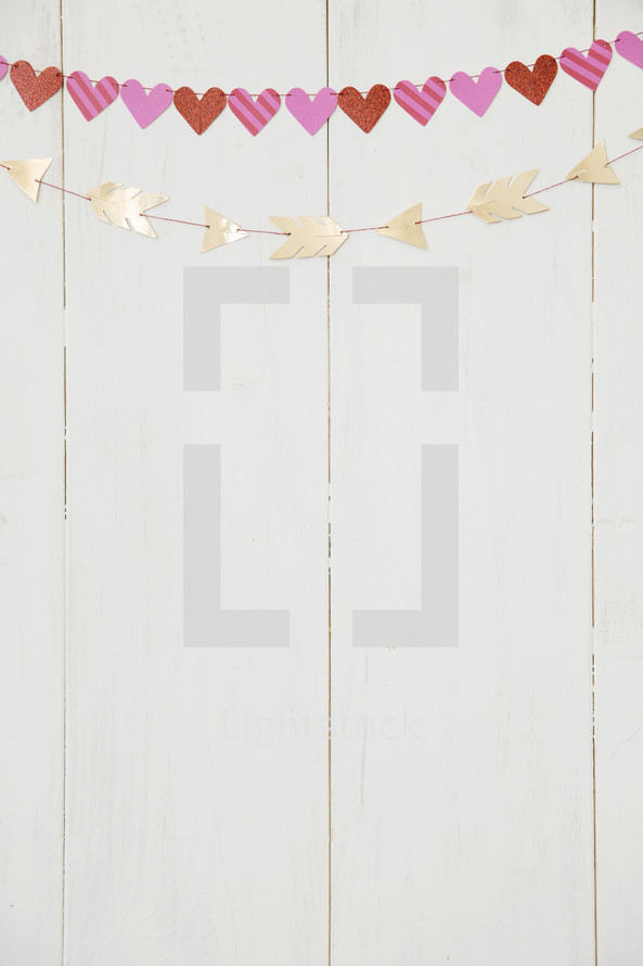 hearts and arrow banner on a white wall 