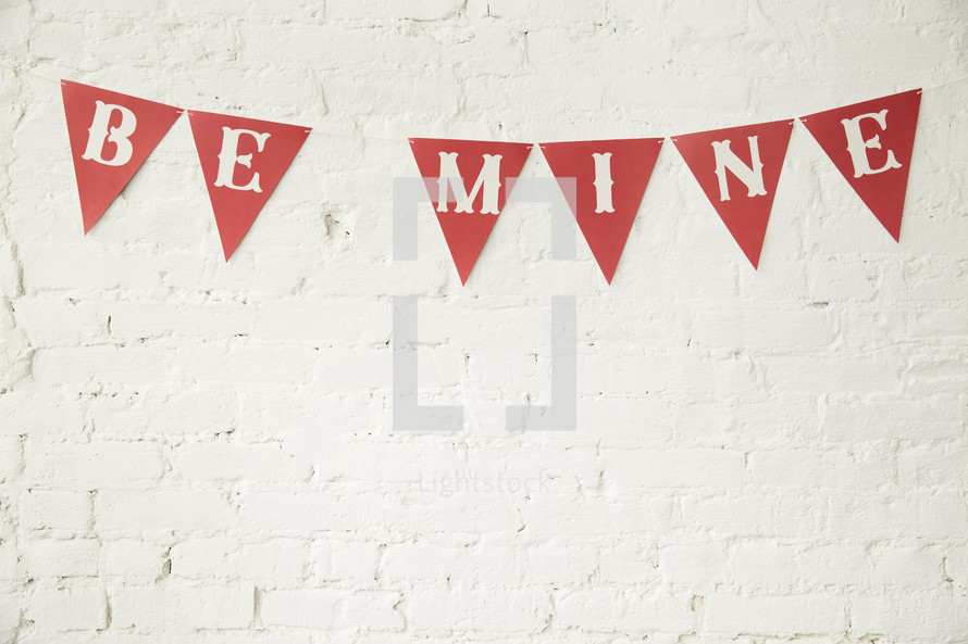 be mine banner on a white wall 