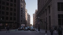 The bustling street activity on State Street in downtown Boston, Massachusetts.