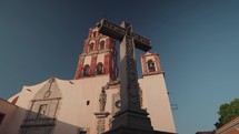 Cross outside of the Templo de Santo Domingo (Temple of St. Dominic Catholic church) in Santiago de Querétaro, Mexico