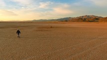A man lost in a barren desert