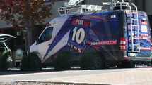 A news truck parked near a crime scene