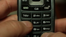 Sending a text message on an outdated flip phone
