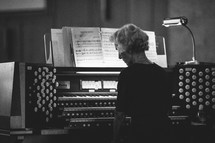 woman playing an organ