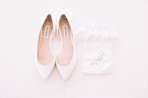 wedding shoes, lace garter, and handkerchief 
