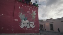 Mural Skull, Flowers and Hummingbirds Se Que Dios Nunca Muere by Alonzo Chavez in Edificio Alcala Oaxaca, Mexico