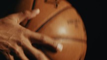 a man spinning a basketball 