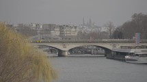 Paris, France - Pont d'Iéna bridge spanning the River Seine and Sacré-Coeur Basilica on The Background