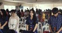 A moment of prayer in the church in the Philippines