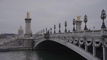 Paris, France - Pont Alexandre III a deck arch bridge with Art Nouveau Lamps that spans the Seine River