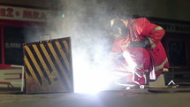 a man in uniform welding 